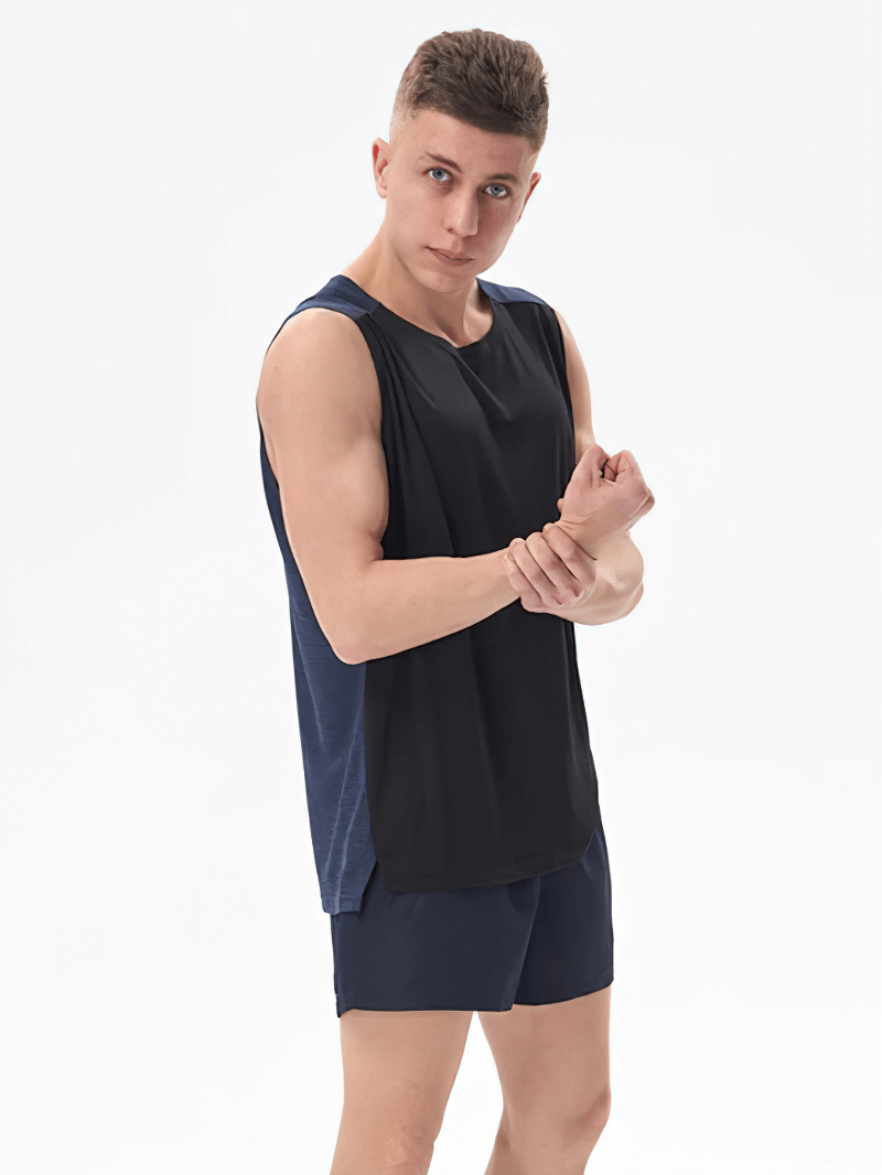 Model wearing Gym Breathable Double Color Tank Top for Men - Comfortable polyester, O-neck, perfect for workouts.